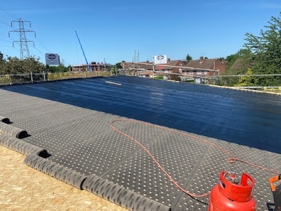 Large commercial flat roof installation in progress by Protec Roofing